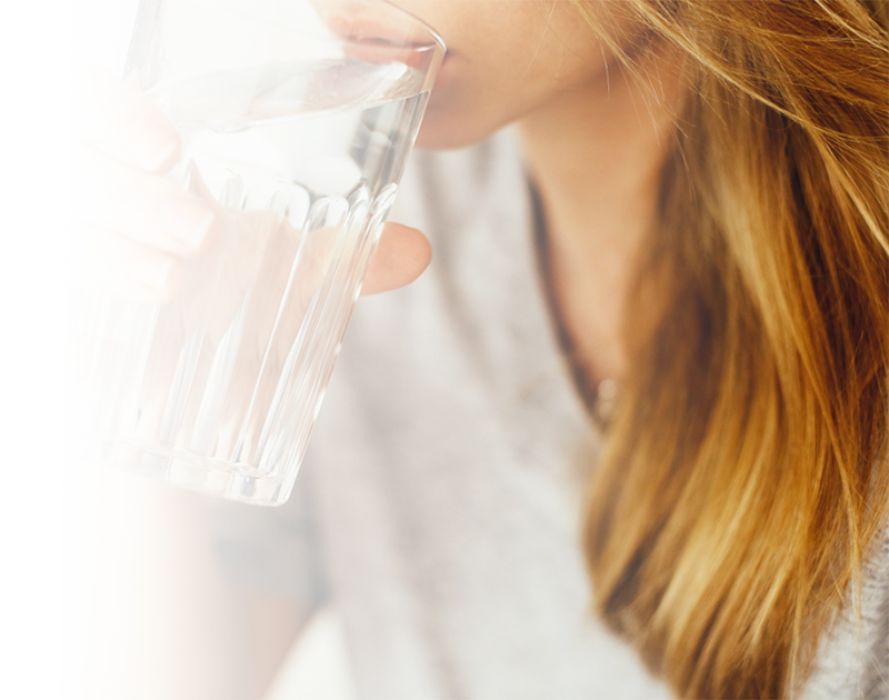an image of a woman drinking water